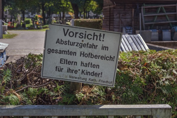Warning sign, danger of falling, parents are liable for their children, catholic cemetery, Kempten, Allgäu, Bavaria, Germany