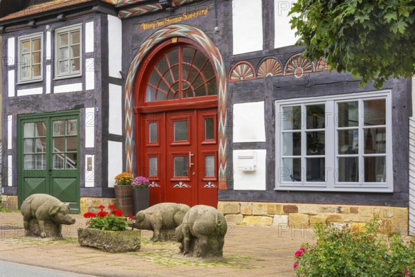 Reminder of former pig market in front of historic half-timbered house Brennerstrasse Rinteln Germany