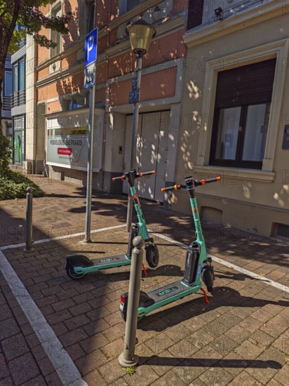 Street in the old town, car park for scooters, e-scooters, sunshine, Brühl, North Rhine-Westphalia, Germany