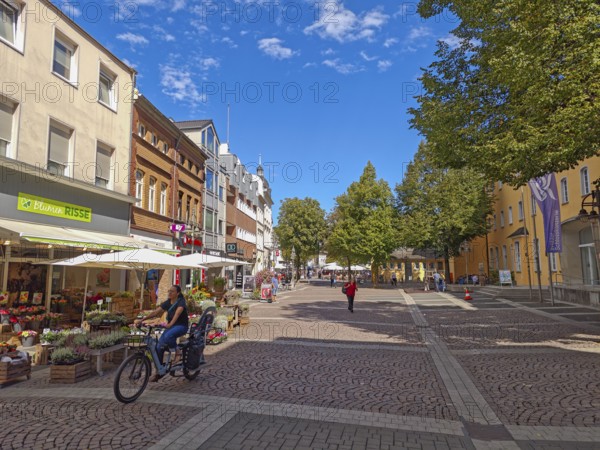 Pedestrian zone, traffic-calmed, old town, architecture, bicycles, café, parasol, flowers, shops, trees, cobblestones, blue sky, sunshine, Brühl, North Rhine-Westphalia, Germany