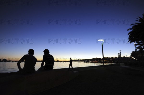 People at the riverside, evening mood at the Swan River, Central City Area, Perth, Western Australia, WA, Australia