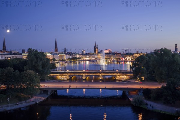 Aerial view of the Outer Alster and Inner Alster with Kennedy Bridge, Alster Fountain, Jungfernstieg, City Hall and Elbphilharmonie at blue hour, Hamburg, Germany
