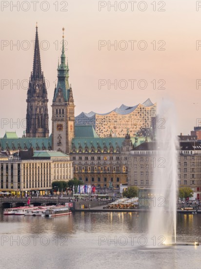 Aerial view of the Inner Alster with Alster fountain, Jungfernstieg, City Hall and Elbphilharmonie at sunset, Hamburg, Germany