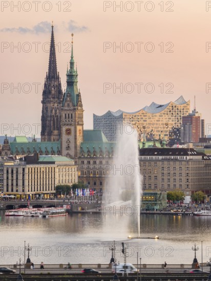 Aerial view of the Inner Alster with Kennedy Bridge, Alster Fountain, Jungfernstieg, City Hall and Elbphilharmonie at sunset, Hamburg, Germany