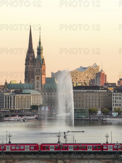 Aerial view of the Inner Alster with Kennedy Bridge, Alster Fountain, Jungfernstieg, City Hall and Elbphilharmonie at sunset, Hamburg, Germany