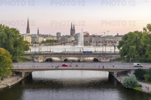 Aerial view of the Outer Alster and Inner Alster with Kennedy Bridge, Alster Fountain, Jungfernstieg, City Hall and Elbphilharmonie at sunset, Hamburg, Germany