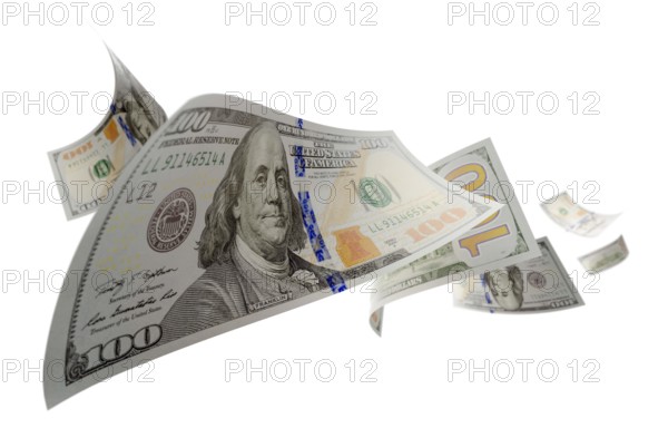 Randomly falling U.S. 100 dollar bills isolated on a white background