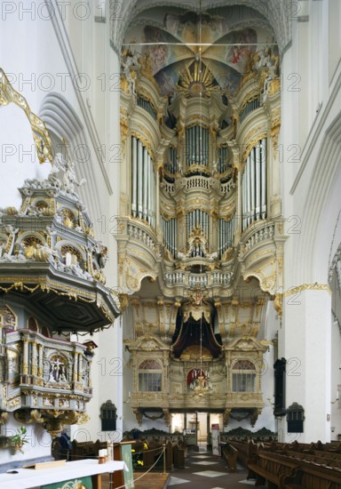 Left Renaissance pulpit from 1574 with baroque pulpit cover from 1723, Marienkirche, Protestant-Lutheran, North German brick Gothic, centre organ built in 1766, below prince's box, choir, basilica, three naves, built from 1290 to mid 15th century, harbour town, Hanseatic city, university town, Rostock, Mecklenburg-Western Pomerania, Germany