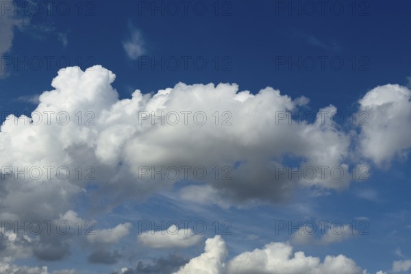 White clouds cumulus heap clouds in front of blue sky, international