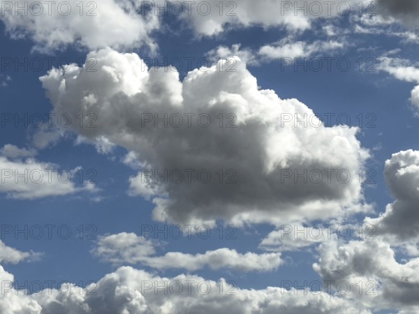 White clouds cumulus heap clouds in front of blue sky, international