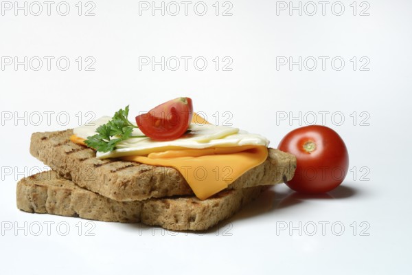 Processed cheese, slices of processed cheese on toast and tomato