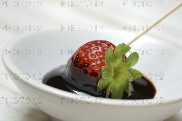 Strawberry and crema di balsamico in small bowls