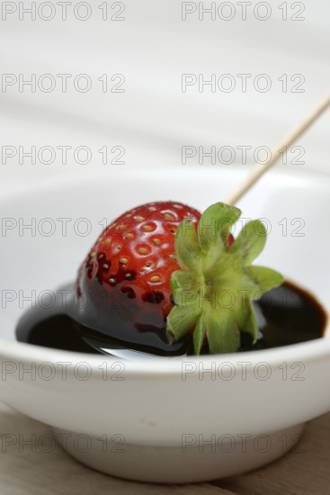 Strawberry and crema di balsamico in small bowls