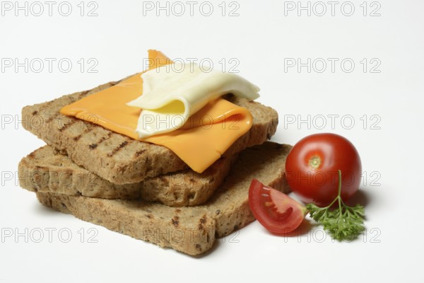 Processed cheese, slices of processed cheese on toast and tomato
