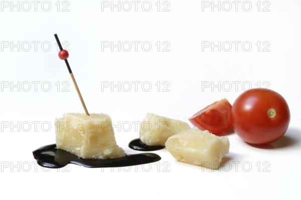Parmesan cheese, pieces of cheese and crema di balsamico