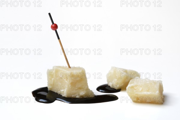 Parmesan cheese, pieces of cheese and crema di balsamico
