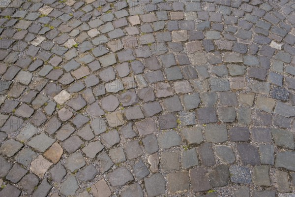 Cobblestones in a curved pattern and earthy colours, North Rhine-Westphalia, Germany