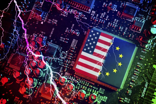 Computer chip with US and EU flags with lightning bolt, symbolic photo Dispute over European digital laws and taxes for US digital companies, photomontage