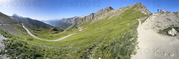 Panoramic view to the left south ramp of the third highest asphalted pass in the Alps highest border pass 2744 m high Col Agnel Colle dell' Agnello Pass in the High Alps Alpine pass above tree line mountain road Alpine road, right at the edge of the picture path to and viewpoint, Col Agnel, Colle dell'Agnello, Pontechianale, Piedmont, Italy