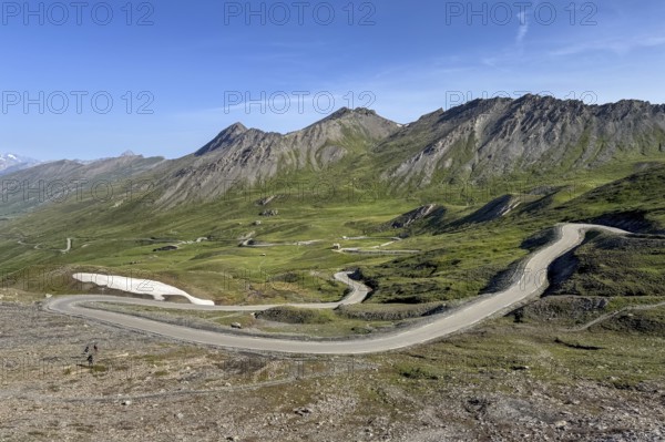 View of northern ramp northern ascent to descent from third highest asphalted pass Alpine pass highest border pass in the Alps 2744 m high Col Agnel above tree line, Colle dell' Agnello Colle dell' Agnello, Pontechianale, Piedmont, Italy