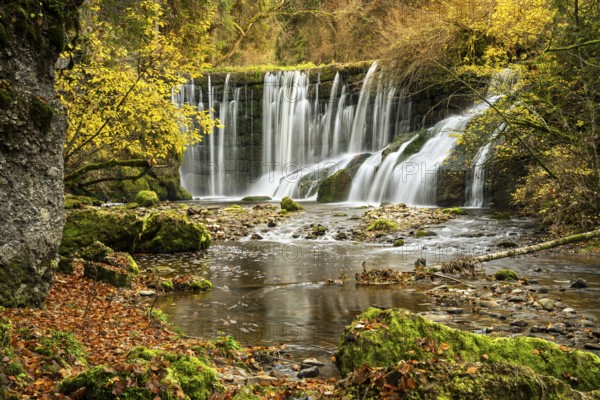 The Gerats waterfall in autumn. Moss-covered rocks and trees in autumn leaves. Gerats, Oberallgäu, Allgäu, Bavaria, Germany