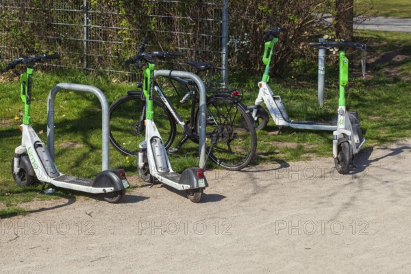 E-scooters parked at a bicycle stand, Germany