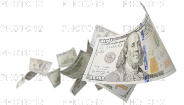 Randomly falling U.S. 100 dollar bills isolated on a white background
