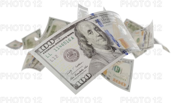 Randomly falling U.S. 100 dollar bills isolated on a white background