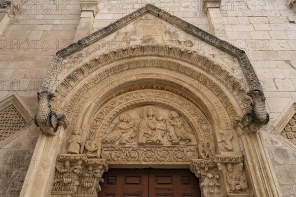 Relief above the portal of the church of Santa Maria Maggiore in Monte Sant'Angelo, Gargano, Apulia, Italy