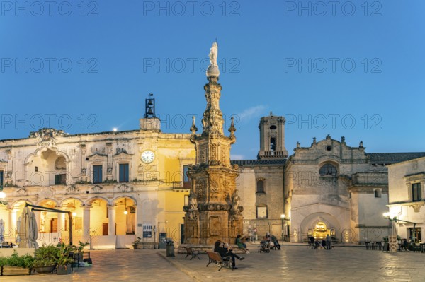 Piazza Salandra with the Guglia dell'Immacolata column and Palazzo di città at dusk, Nardo, Apulia, Italy