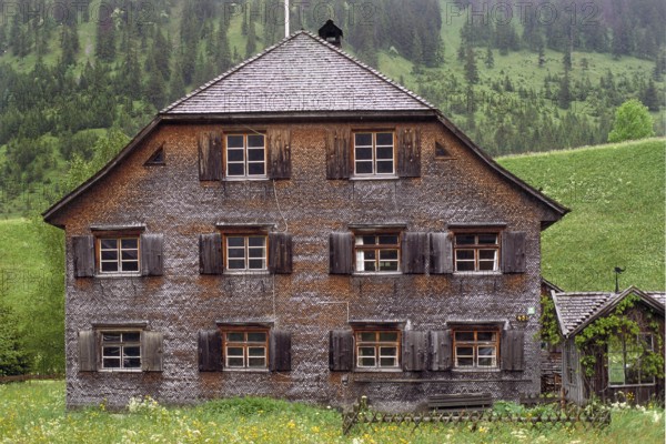 Historic farmhouse with wooden shingles, Hinterstein, Oberallgäu, Bavaria, Germany