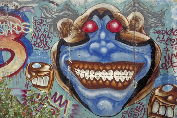 Painting at the Berlin Wall, created in the 1990s, Berlin, Germany