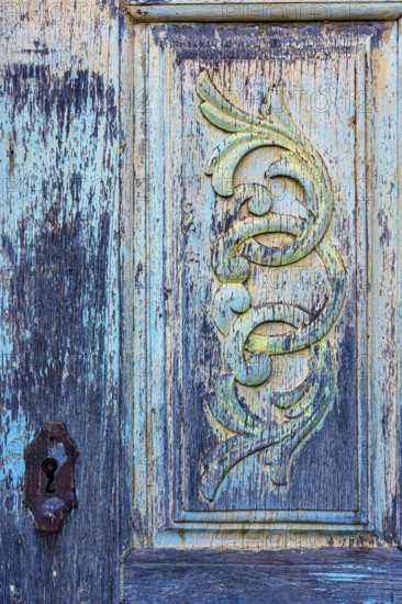 Texture and design of an old carved wooden baroque church door, Ouro Preto, Minas Gerais, Brazil