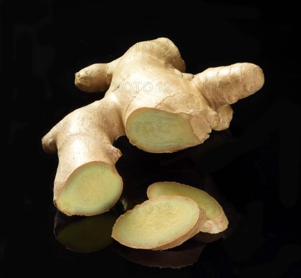 Ginger (Zingiber officinale) against a black background