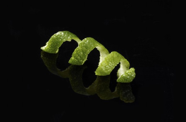 Lime zest against a black background