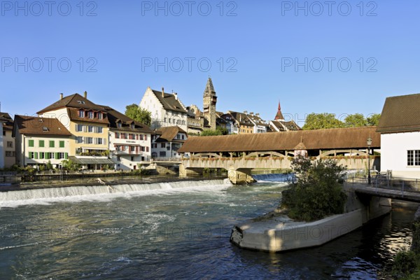 Old town with the tower of the Muri- Amthof, in the foreground the weir, the old wooden bridge over the river Reuss, Bremgarten, Freiamt, Canton, Aargau, Switzerland