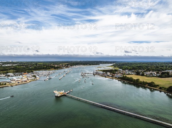 River Hamble over Warsash Maritime Academy Pier from drone, Hamble-le-Rice, Warsash, Southampton Water, Hampshire, England, United Kingdom