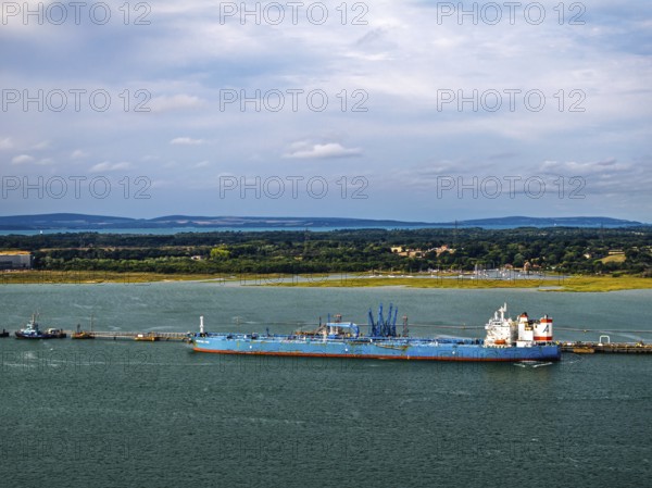 Gas tankers over refinery Esso Oil Terminal from drone, Southampton, Hampshire, England, United Kingdom