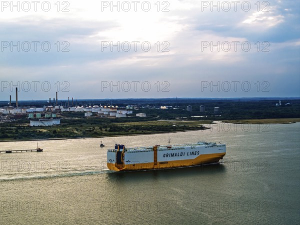 Grimaldi Lines Vehicles Carrier Grande Texas over refinery Esso Oil Terminal from drone, Southampton, Hampshire, England, United Kingdom