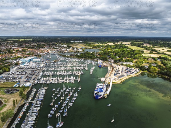 Wight Light car ferry to Isle of Wight on Lymington River and marina from drone, Lymington, New Forest, Hampshire, England, United Kingdom