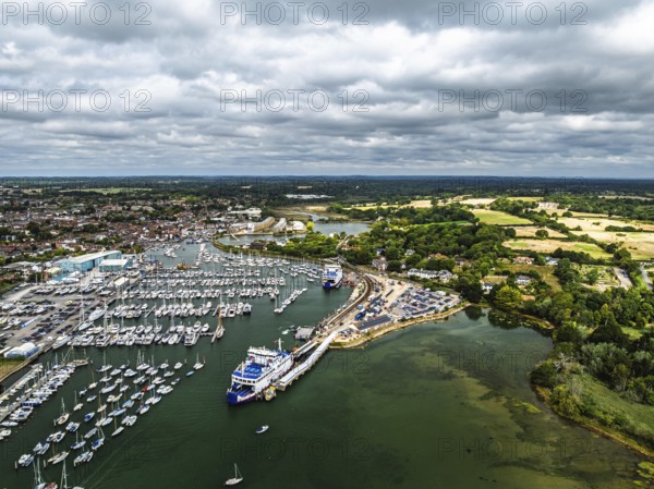 Wight Light car ferry to Isle of Wight on Lymington River and marina from drone, Lymington, New Forest, Hampshire, England, United Kingdom