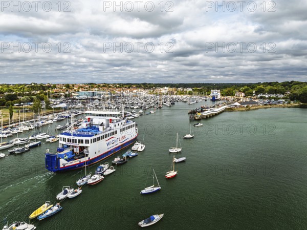 Wight Light car ferry to Isle of Wight on Lymington River and marina from drone, Lymington, New Forest, Hampshire, England, United Kingdom