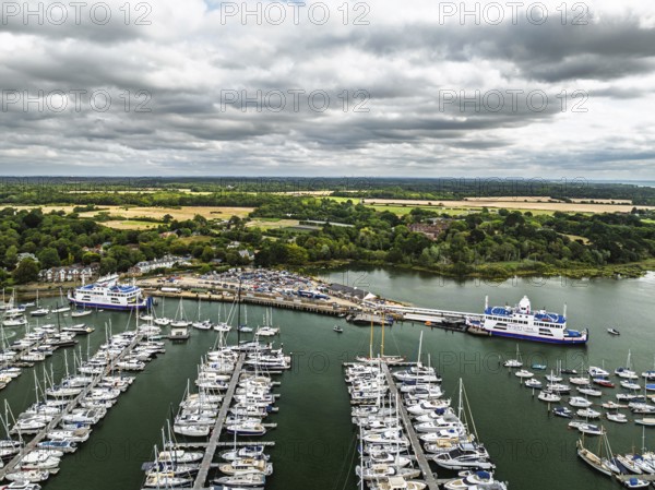 Wight Light car ferry to Isle of Wight on Lymington River and marina from drone, Lymington, New Forest, Hampshire, England, United Kingdom