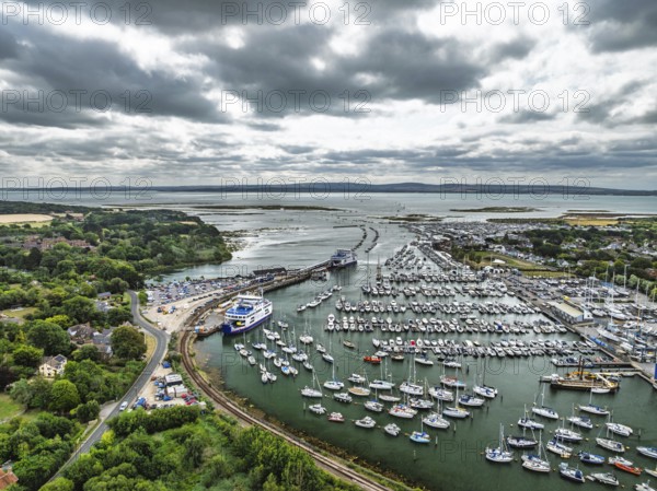 Wight Light car ferry to Isle of Wight on Lymington River and marina from drone, Lymington, New Forest, Hampshire, England, United Kingdom