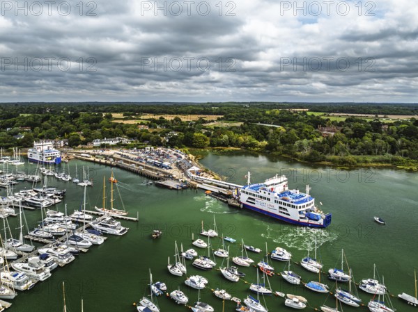 Wight Light car ferry to Isle of Wight on Lymington River and marina from drone, Lymington, New Forest, Hampshire, England, United Kingdom