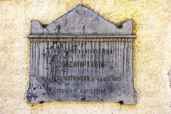 Weathered memorial plaque to the mountaineer Joachim Tabin, Saint Barthelemy church, Val d'Anniviers, Valais Alps, Canton Valais, Switzerland