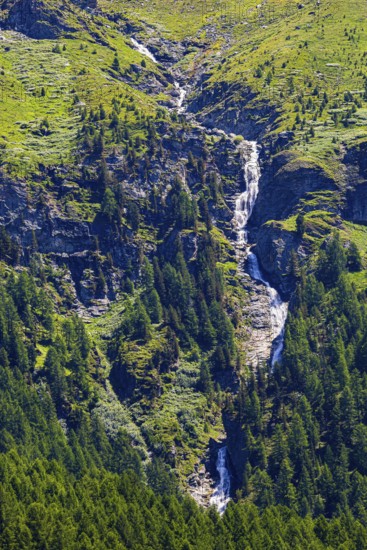 Waterfall cascading over rocks, near Zinal, Val d'Anniviers, Valais Alps, Canton Valais, Switzerland
