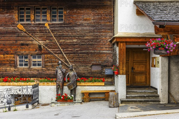 Copper sculptures of drummers and pipers, Saint Luc town house, Val d'Anniviers, Valais Alps, Canton Valais, Switzerland