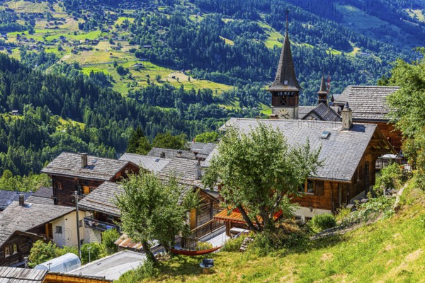 Houses with wooden shingle roofs, behind the church of Saint Anna, Ayer, Val d'Anniviers, Valais Alps, Canton Valais, Switzerland