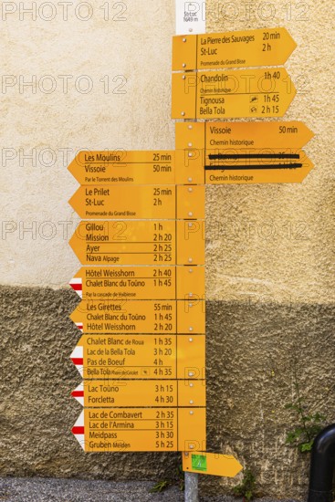 Hiking signpost in Saint Luc, Val d'Anniviers, Valais Alps, Canton Valais, Switzerland